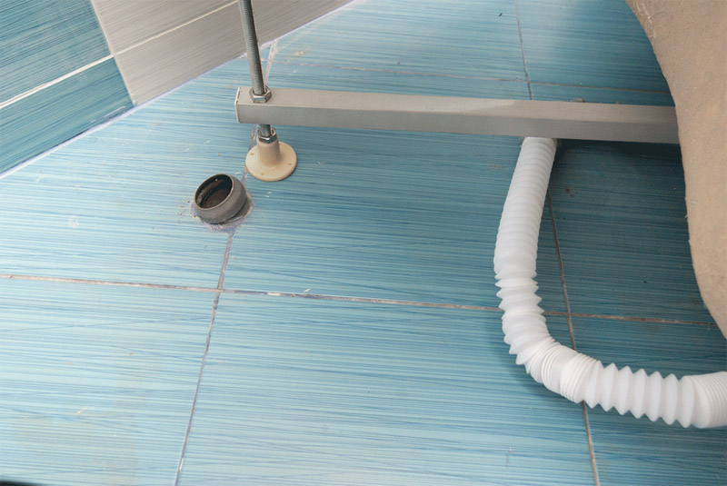 Comment connecter une cabine de douche au réseau d'assainissement